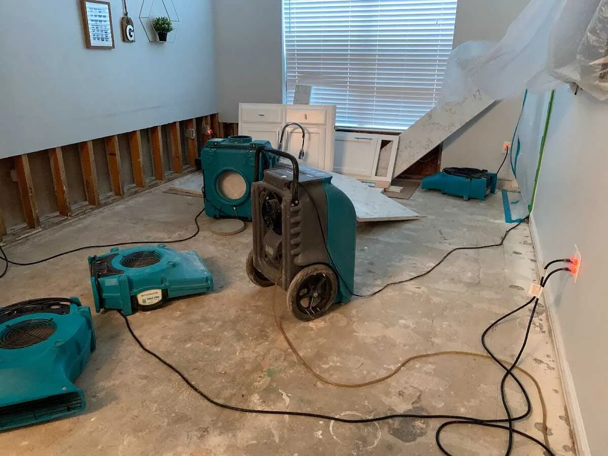 Dehumidifier in flood-cut room for Water Damage Restoration in Solon